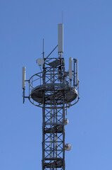 radio tower with blue sky in the background