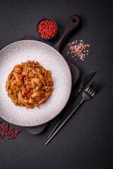 Delicious asian udon dish with vegetables, mushrooms, salt and spices