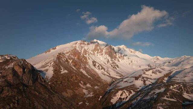 Aerial drone view of snowy Mt Korab summit in Alps of Albania during sunset