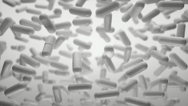 Capsules are moving upward on a grey background. Tablet pills capsules float slowly in slow motion. 3d rendering