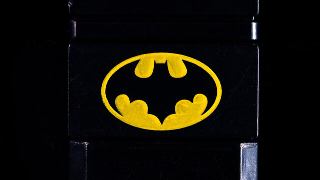 DC's BATMAN logo on a black plastic column