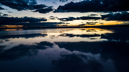 Landscape beautiful sunset black sky salt lake.reflection of clouds in still water