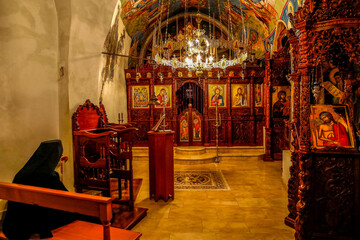 Fototapeta na wymiar Our Lady of Hamatoura orthodox monastery, Kannoubine Valley, Lebanon. Monk in church