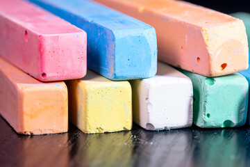 A pile of colored chalk closeup. Colored children's chalk for drawing