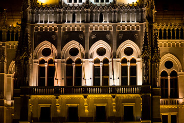 Night Parliament in Budapest. Facade of the Hungarian Parliament. Illuminated in gold color. Night...