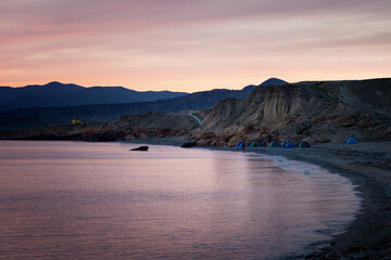 Night camping on shore. Outdoor lifestyle concept