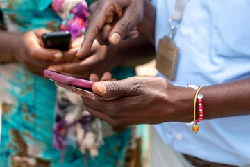 Foto op Canvas Mobile banking in northern Rwanda © Julian
