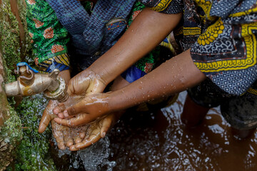 Children washing their hands in a village near Gicumbi, northern province, Rwanda