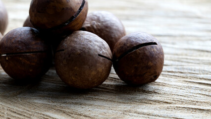 macadamia nuts on a wooden background