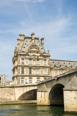 Travel in summer on a river boat along the Seine River in the center of Paris and see the sights, buildings and bridges