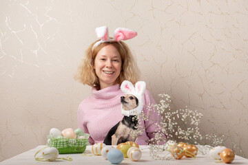 Easter dog and owner wearing bunny ears, celebrating the holiday with playful rabbit costume, pet...