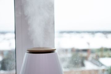Air humidifier by the window, combating winter dryness, ultrasonic diffusion, home comfort