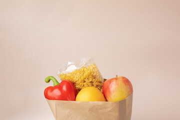 Grocery bag filled with nutritious food, fresh fruits, and vegetables, healthy lifestyle