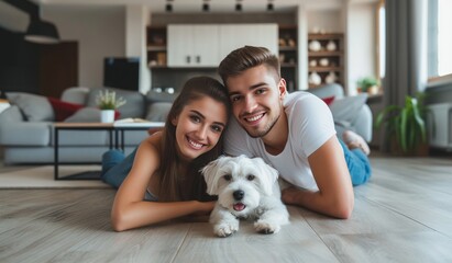 A happy married couple, a young girl and a  man are lying on the floor in the modern interior of the living room after buying  house.