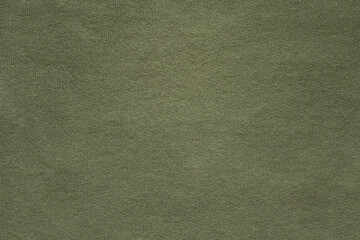 Dark green cotton fabric background with copy space