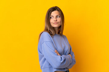 Young Slovak woman isolated on yellow background keeping the arms crossed