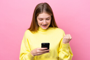 Fototapeta premium Teenager Russian girl isolated on pink background surprised and sending a message