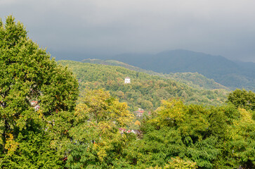 Fototapeta premium White chapel on a hill in autumn