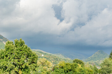 Fototapeta na wymiar White chapel on a hill in autumn