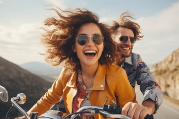 Exuberant couple on a motorcycle adventure with scenic backdrop