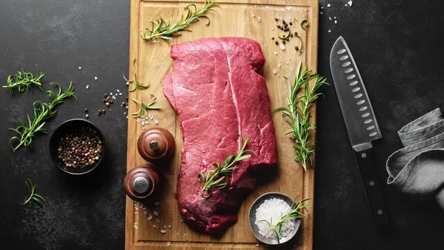 Beef meat entrecote on a cutting board, raw beef meat fillet on kitchen desk, stock footage video 4k