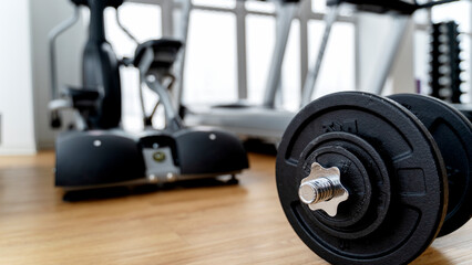 Fototapeta na wymiar dumbbells and exercise equipment in the gym
