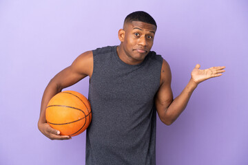 Young basketball latin player man isolated on purple background having doubts while raising hands