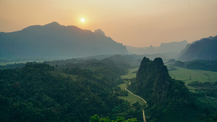 Beautiful Forest landscape of Sunset panoramic view from Nam Xay viewpoint in Vang Vieng at sunset,...