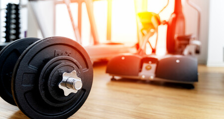 dumbbells and exercise equipment in the gym