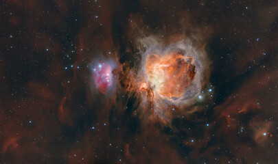 Astrophoto made with telescope of the Orion Nebula or M42, with red hydrogen gas