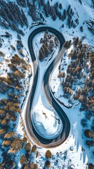 Aerial view of the winding Snake Road in winter in the Dolomite Alps of Italy