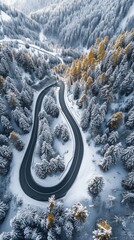 Aerial view of the winding Snake Road in winter in the Dolomite Alps of Italy