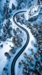 Aerial view of the winding Snake Road in winter in the Dolomite Alps of Italy