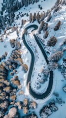Aerial view of the winding Snake Road in winter in the Dolomite Alps of Italy