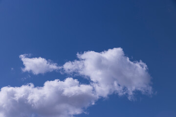 blue sky with cumulus clouds in spring