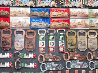 Showcase of different souvenirs for sale at the market in Rome. Refrigerator magnets are very...