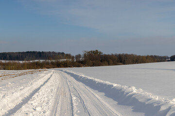 winter road after snowfall in sunny weather