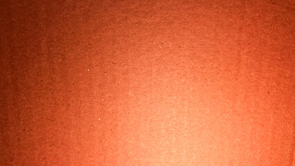 Cardboard paper background. Wallpaper with carton color brown. Soft focus. film grain pixel texture. Defocused.