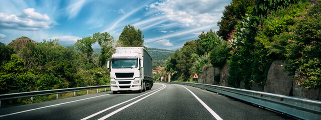 White Truck Or Tractor Unit, Prime Mover, Traction Unit In Motion On Road, Freeway. Asphalt...