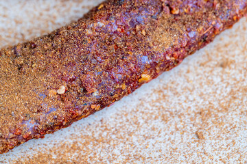 very spicy pork meat with red hot pepper on the table