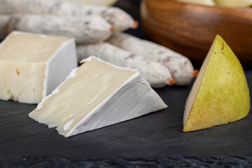 delicious sliced cheese with edible white mold