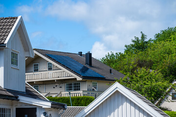 Solar cells mounted on rhe roof of a house.