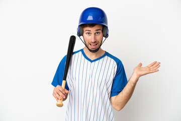 Young caucasian man playing baseball isolated on white background with shocked facial expression