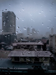 Rain water drops on building window in Panama City
