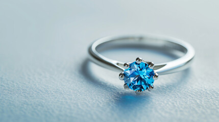 "A Luxurious and Expensive Women's Ring Featuring a Captivating Blue Topaz Gemstone, Isolated on a White Background."