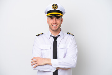Airplane caucasian pilot isolated on white background keeping the arms crossed in frontal position
