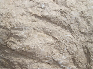 Textured stone wall. Natural stone background. Rock texture backgrounds close up.
