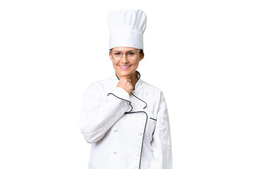 Middle-aged chef woman over isolated background with glasses and smiling