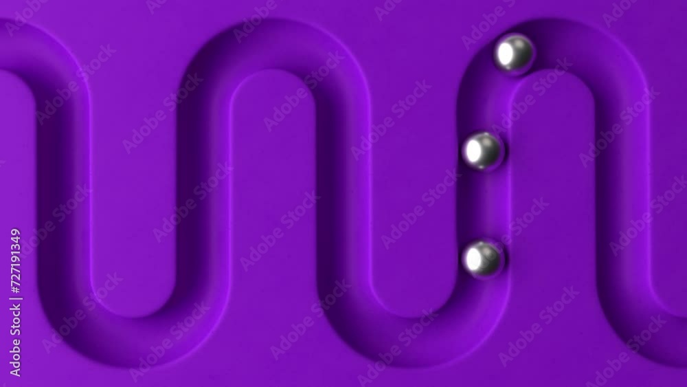 Poster cycled minimal animation. metal balls rolling in geometry deepening. ball rolling along the paths. 3