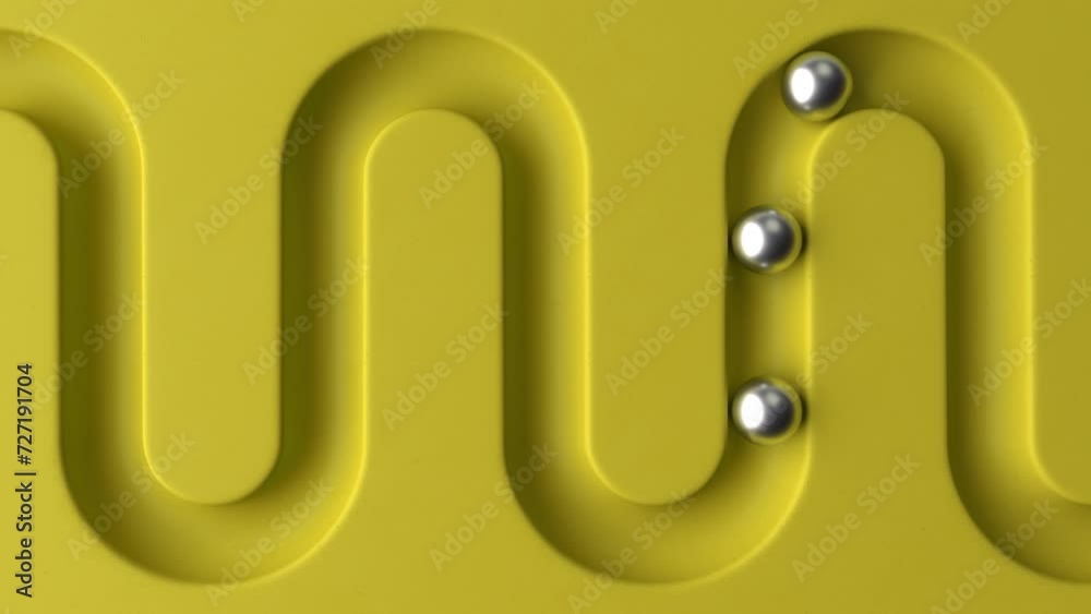 Poster Cycled minimal animation. Metal balls rolling in geometry deepening. Ball rolling along the paths. 3d animation of a seamless loop